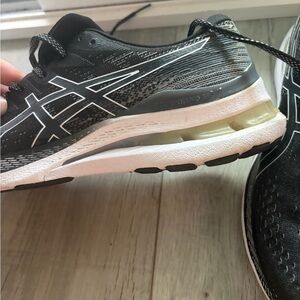 ASICS woman’s  Black and White running shoes
